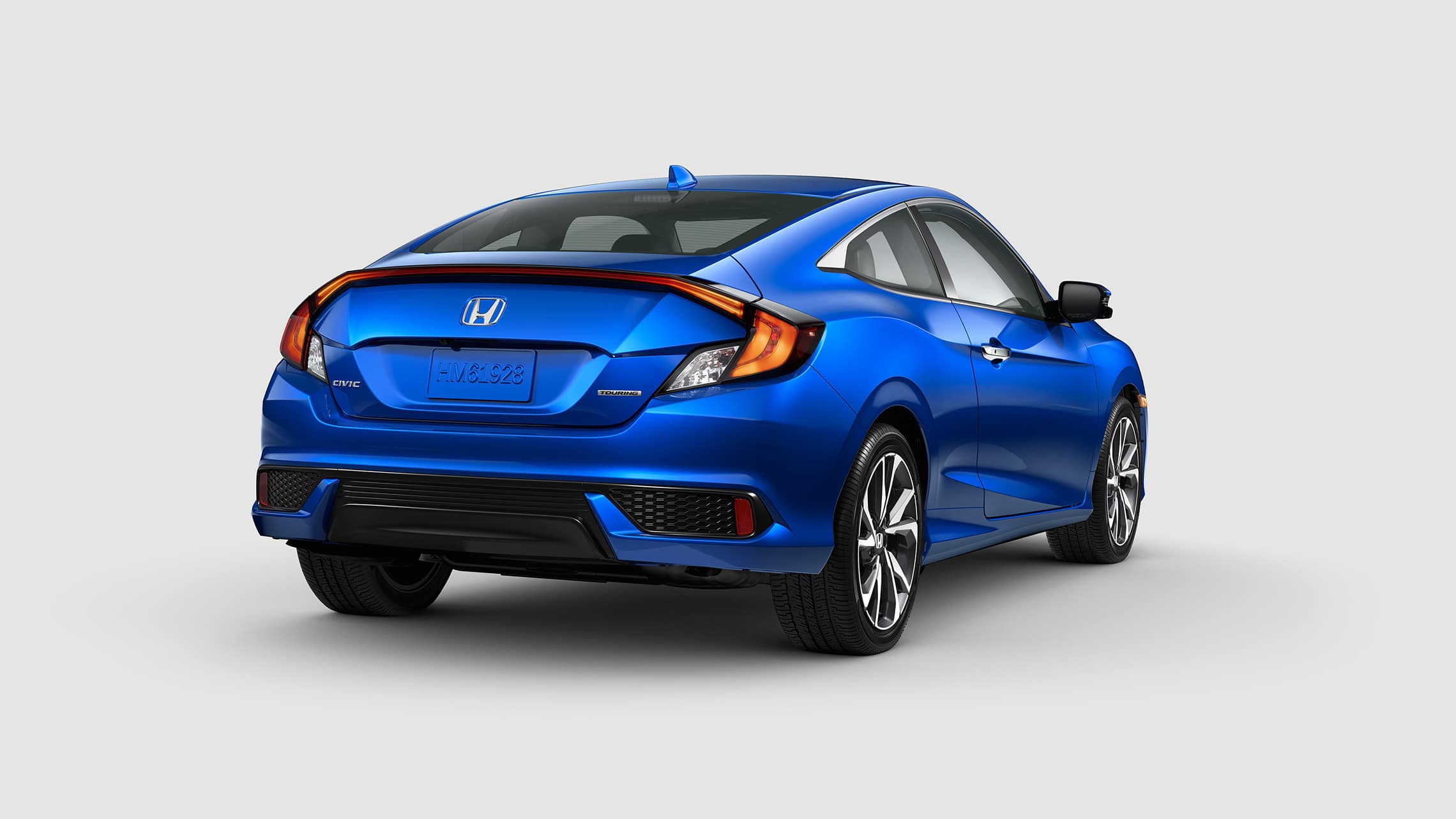 passenger-side view of the the 2020 honda civic touring coupe in